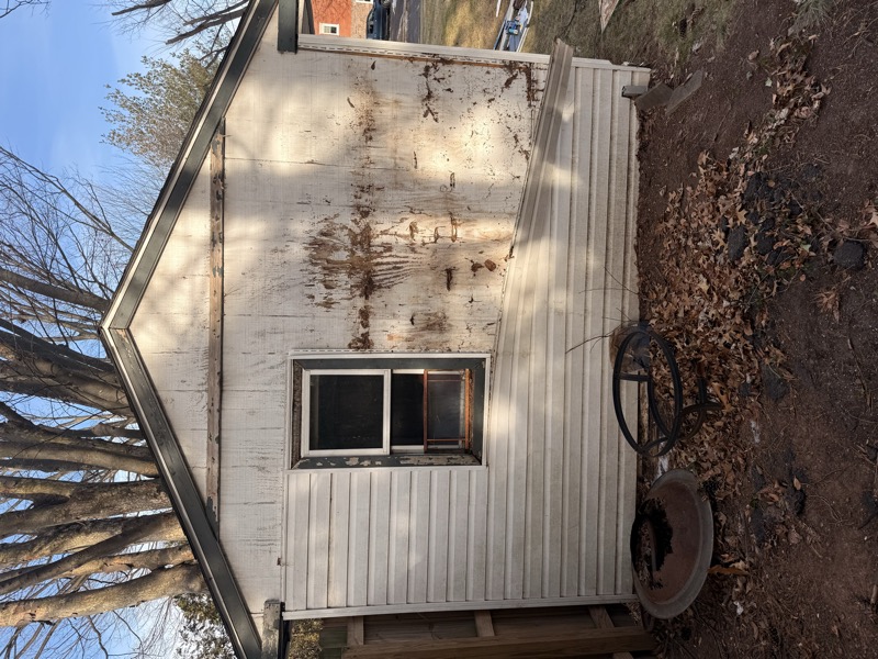 After — remodeled shed with fresh siding and trim
