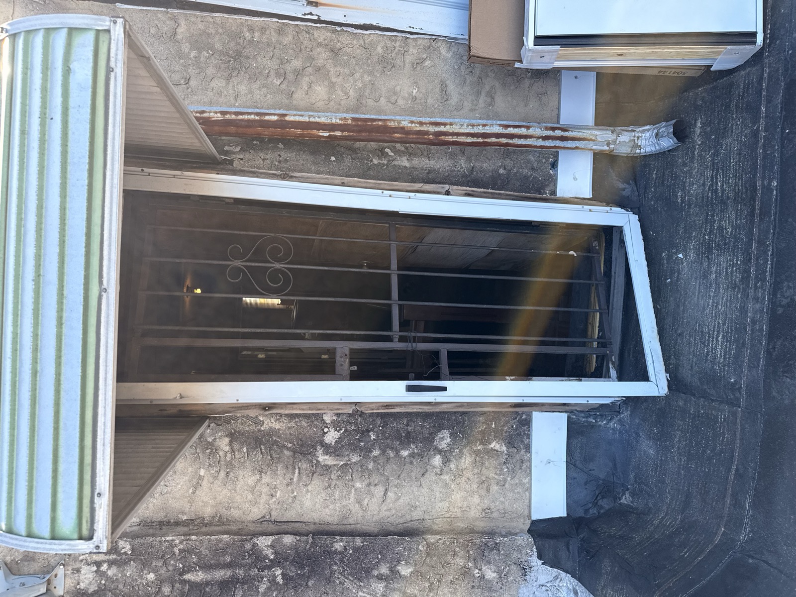 Exterior door before — rusted frame